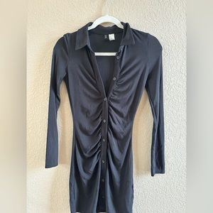 Formal or casual black snatching dress with buttons and ribbing on the front